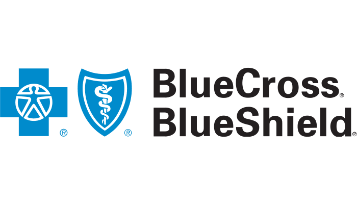 Blue Cross Blue Shield logo featuring a blue cross with a stylized human figure, a blue shield with a white snake and staff symbol, and "BlueCross BlueShield" in bold black letters—recognized for supporting autism therapy near Houston TX.
